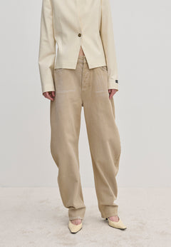 Relaxed-fit, beige Freya Denim Jeans (30 - Short) in a barrel-leg style with a faded wash, paired with a cream blazer and pointed-toe heels.