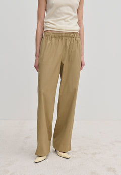 Beige Davi Mid waist Pants featuring an elasticated waistband and a wide-leg, straight-fit silhouette.