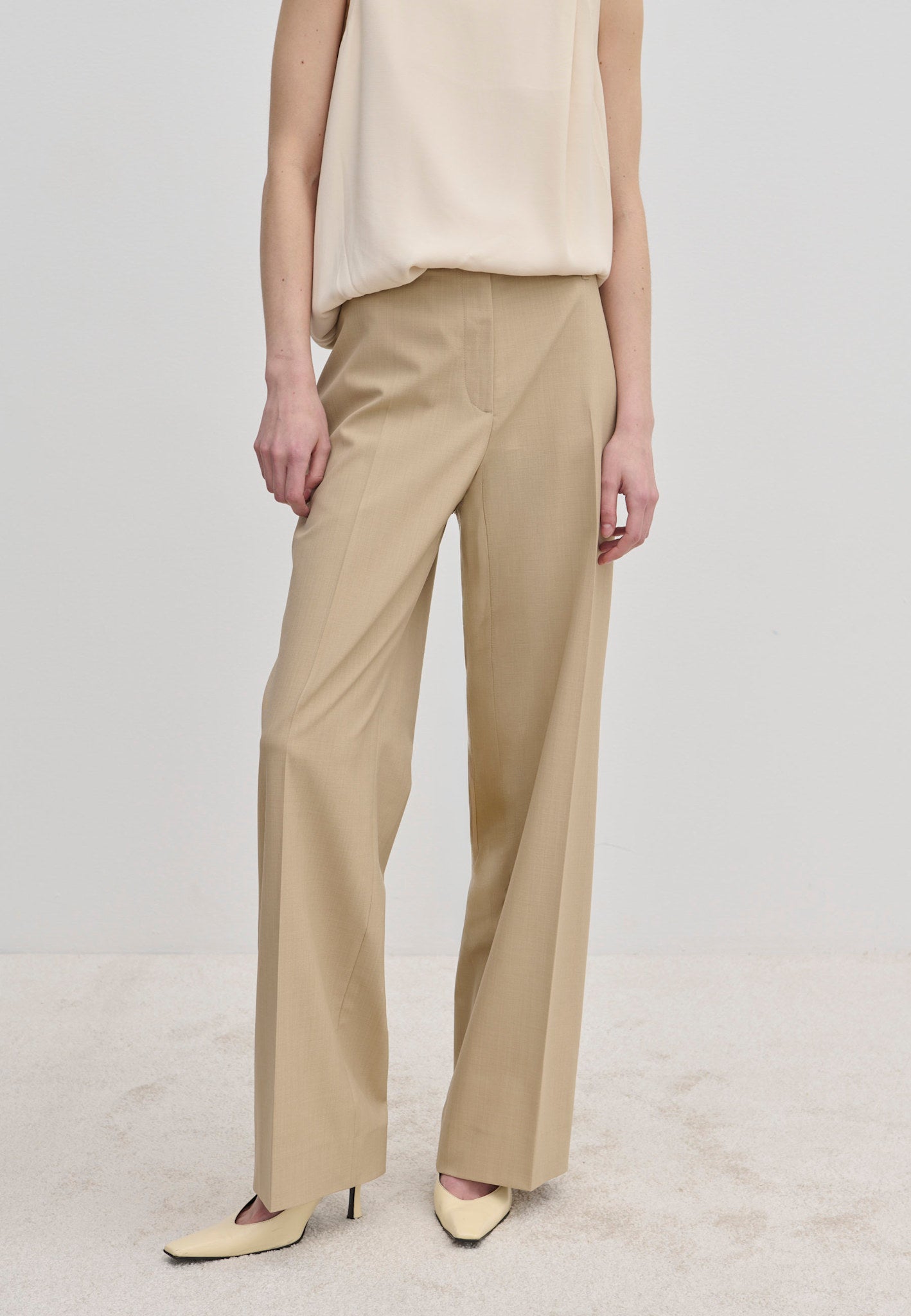 Beige Ivano Mid waist Pants by Herskind ApS in a straight-leg, regular fit with center-front creases.