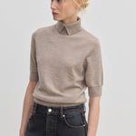 Taupe short-sleeved Perry Knit Blouse by Herskind ApS in merino wool with a pointed collar.