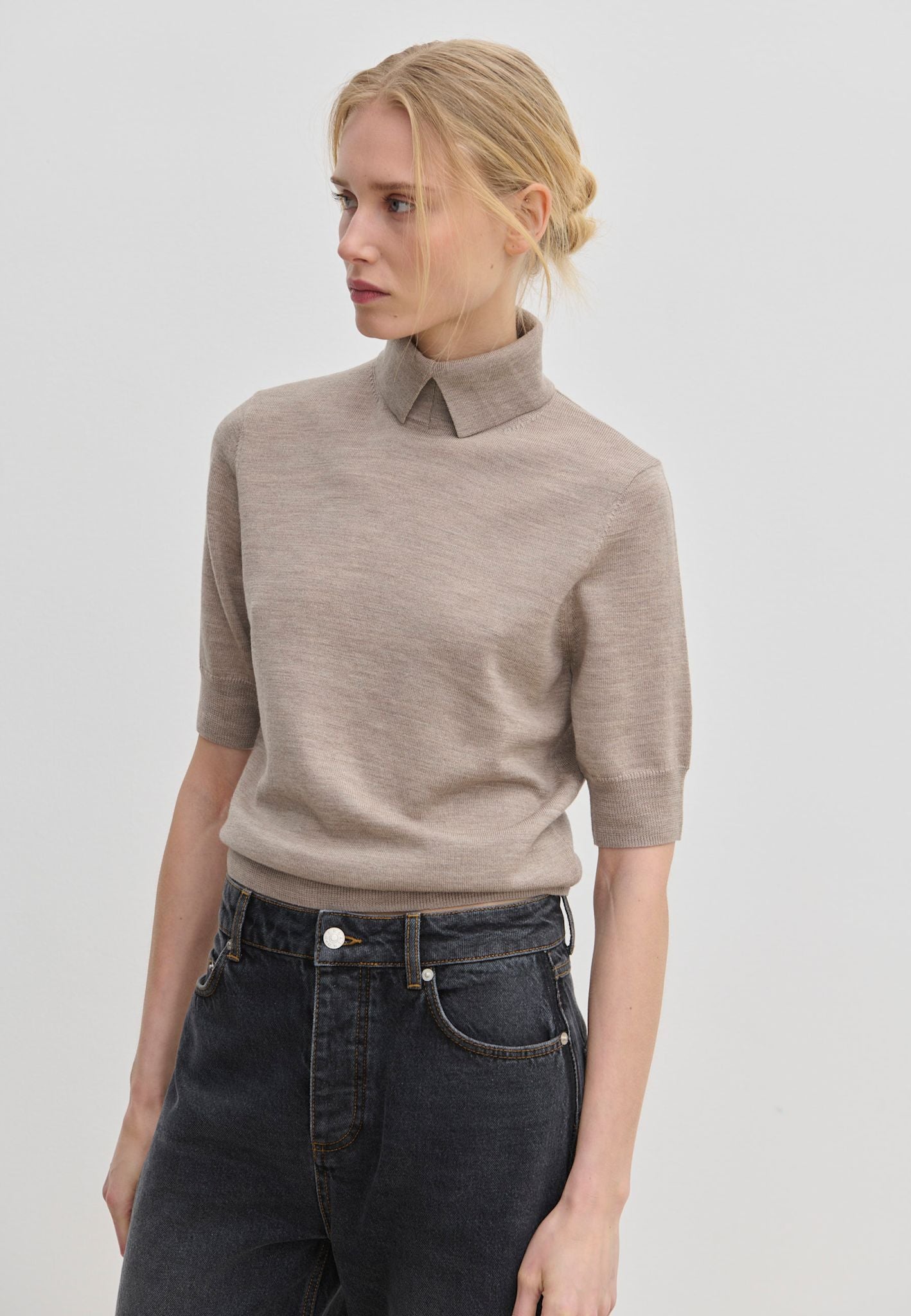 Taupe short-sleeved Perry Knit Blouse by Herskind ApS in merino wool with a pointed collar.