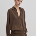 Agatha Knit Blouse by Herskind ApS in a brown fine-gauge knit with a polo collar and a front zipper.