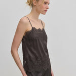 Herskind ApS Linnea Top in dark grey, featuring adjustable straps and lace trim along the neckline and hem.