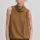 The Herskind ApS Loa Top is a sleeveless brown garment in a relaxed fit with a high, draped cowl neckline.