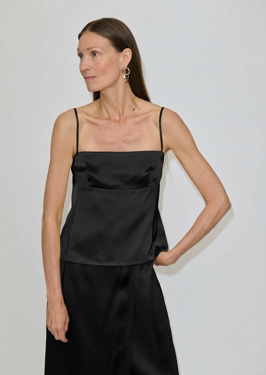 Black Angela Top by Herskind ApS featuring a square neckline and thin, adjustable spaghetti straps.
