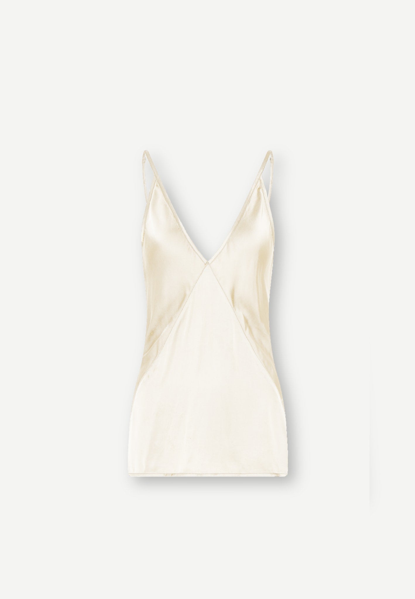 White Mille Top - Medium White FSC viscose slip top with a deep V-neck, thin spaghetti straps, and paneled detailing.